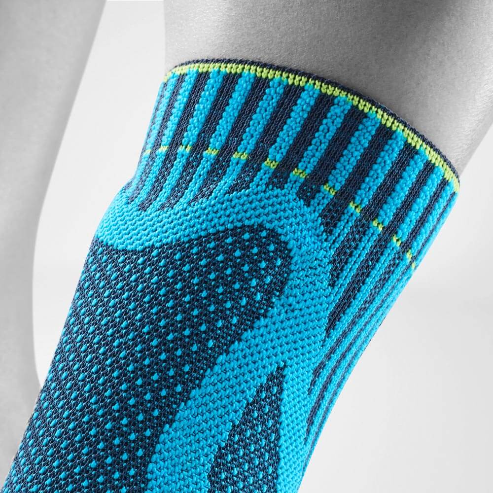 Achille Bandage Bandage Rivera Dettagli Achille Pad Vista dettagliata nella parte superiore della parte superiore della benda di Achille colorata di Rivera con diversi motivi a maglia e la pelotta curva sotto il maglia